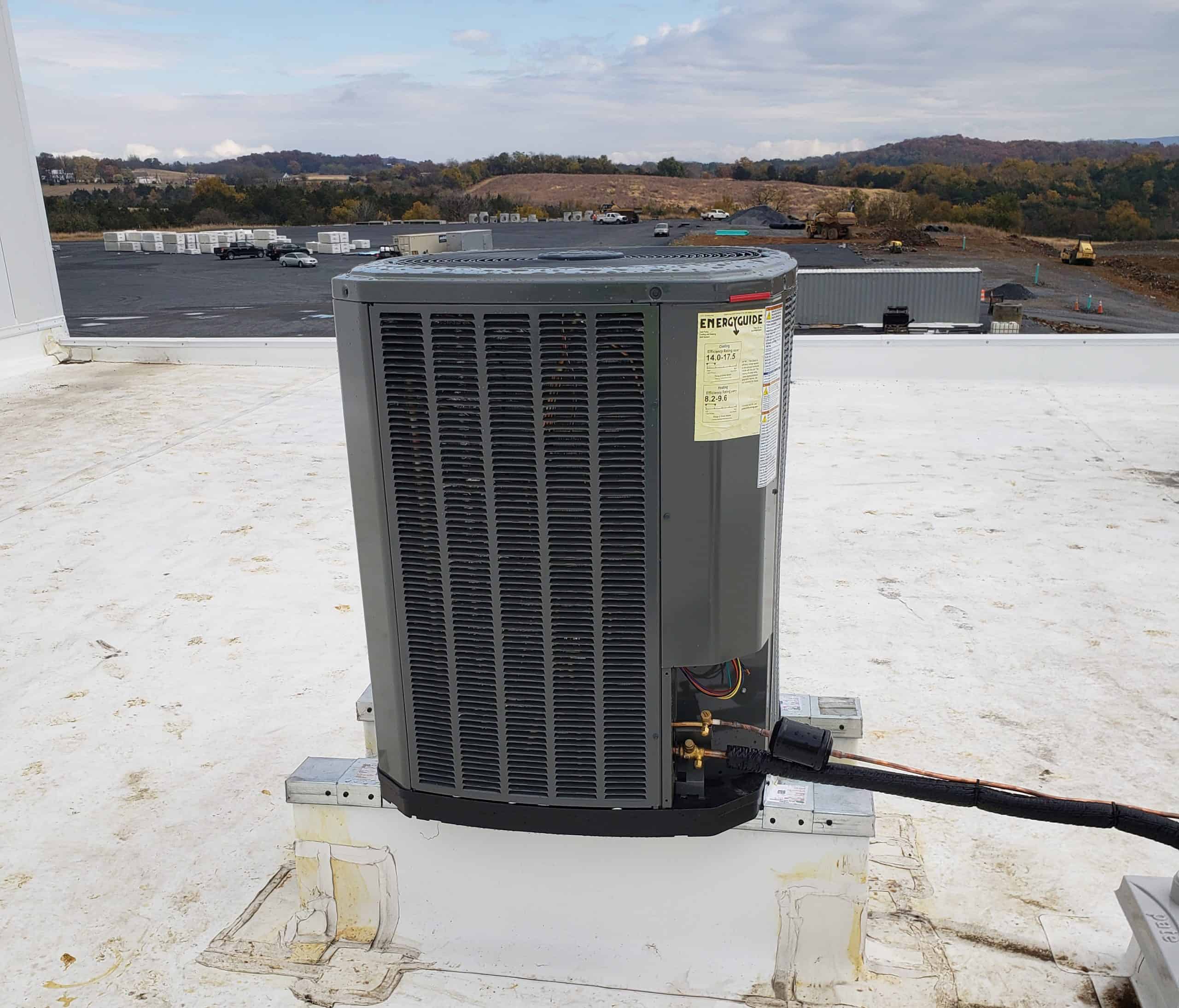 Rooftop split system HVAC unit installed on top of a building