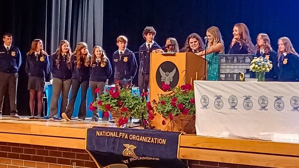 Person standing at a podium during the FFA Banquet at East Rock High School