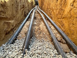 Source Heat Exchange Piping Loops for a geothermal heat pump being laid underground