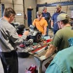 RBI techs learning in our garage area