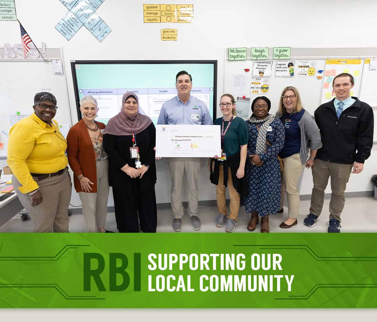 RBI Supporting our Local Community. RBI president and team presenting a check to Harrisonburg City Public Schools Educational Foundation in a classroom