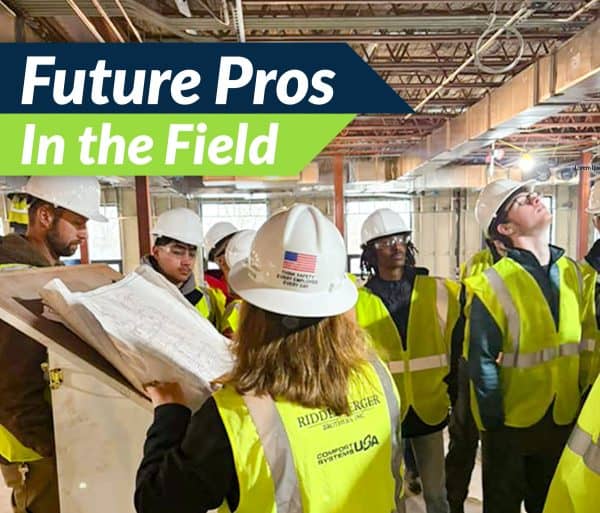 Future Pros in the Field. Students touring an in-progress facility