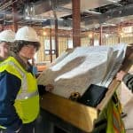 Students touring an in-progress facility