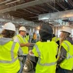 Students touring an in-progress facility