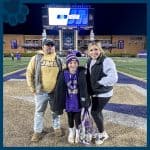 RBI Top Dog, Lacey, and family on JMU's field