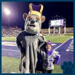 RBI Top Dog, Lacey, with JMU's mascot on the field