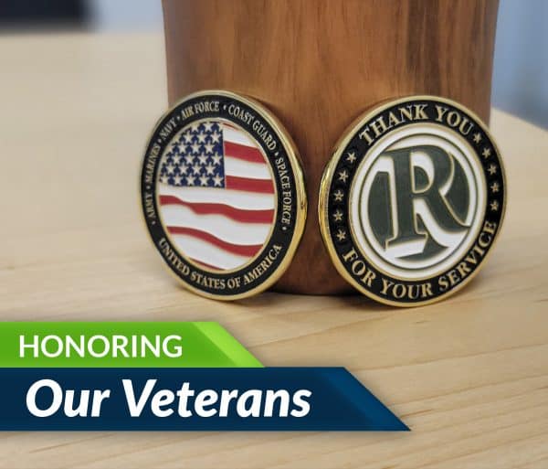 Honoring Our Veterans text with image showing challenge coins