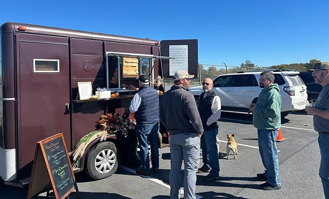 RBI 2025 United Way Food Truck Fundraiser People in line at a food truck in RBI's parking lot