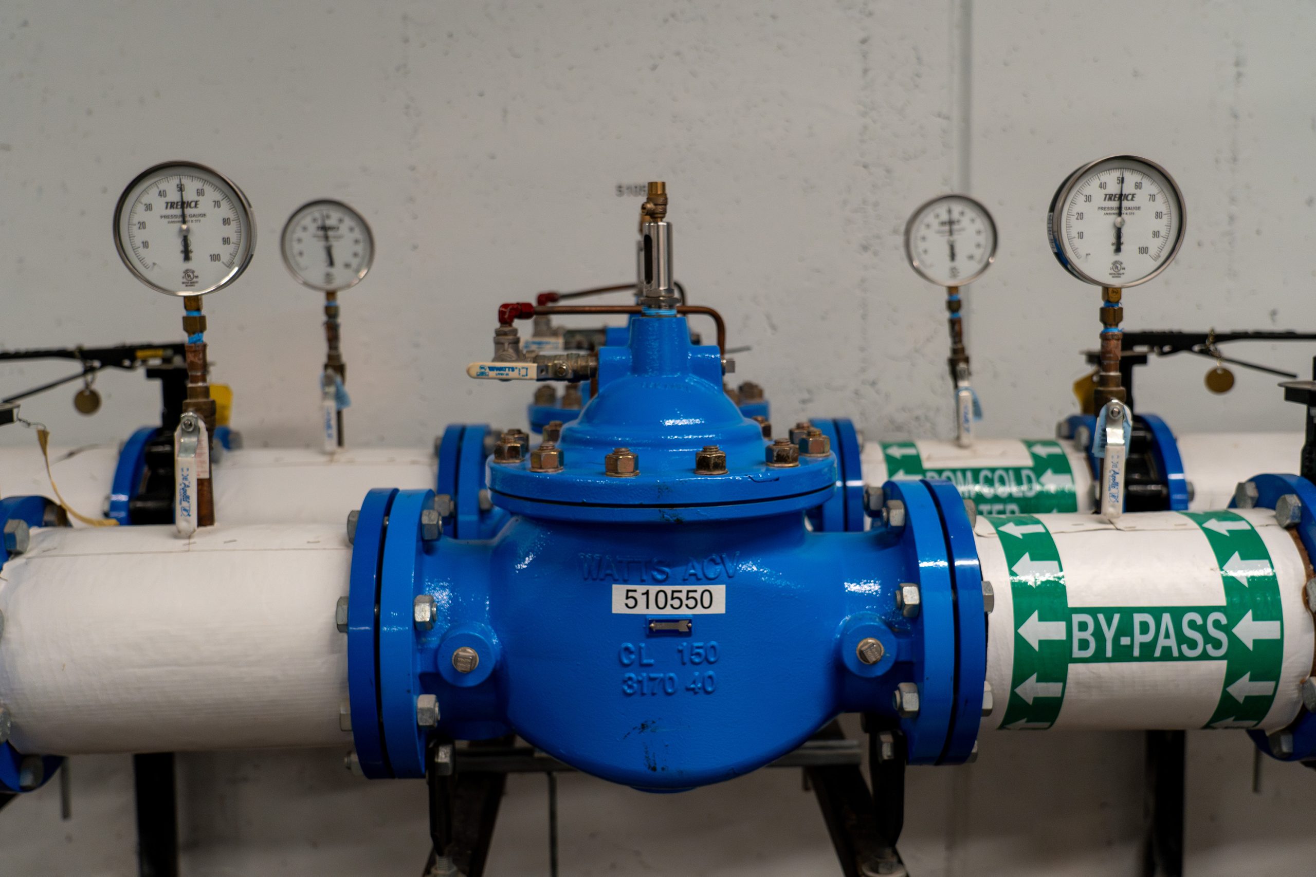 A commercial backflow preventer connecting two pipes