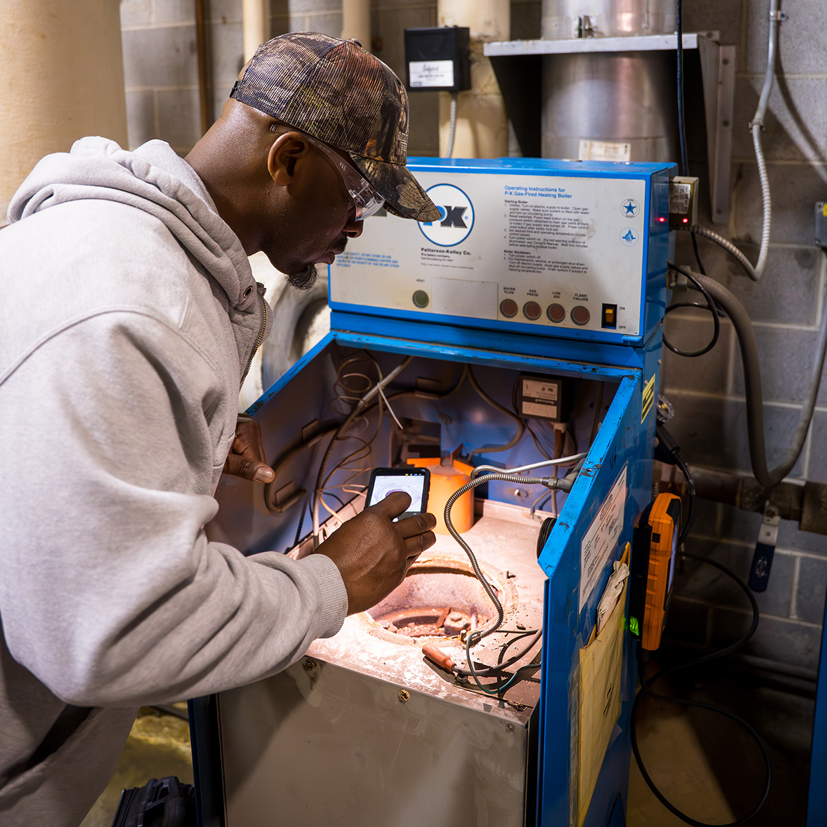 RBI technician inspecting HVAC equipment